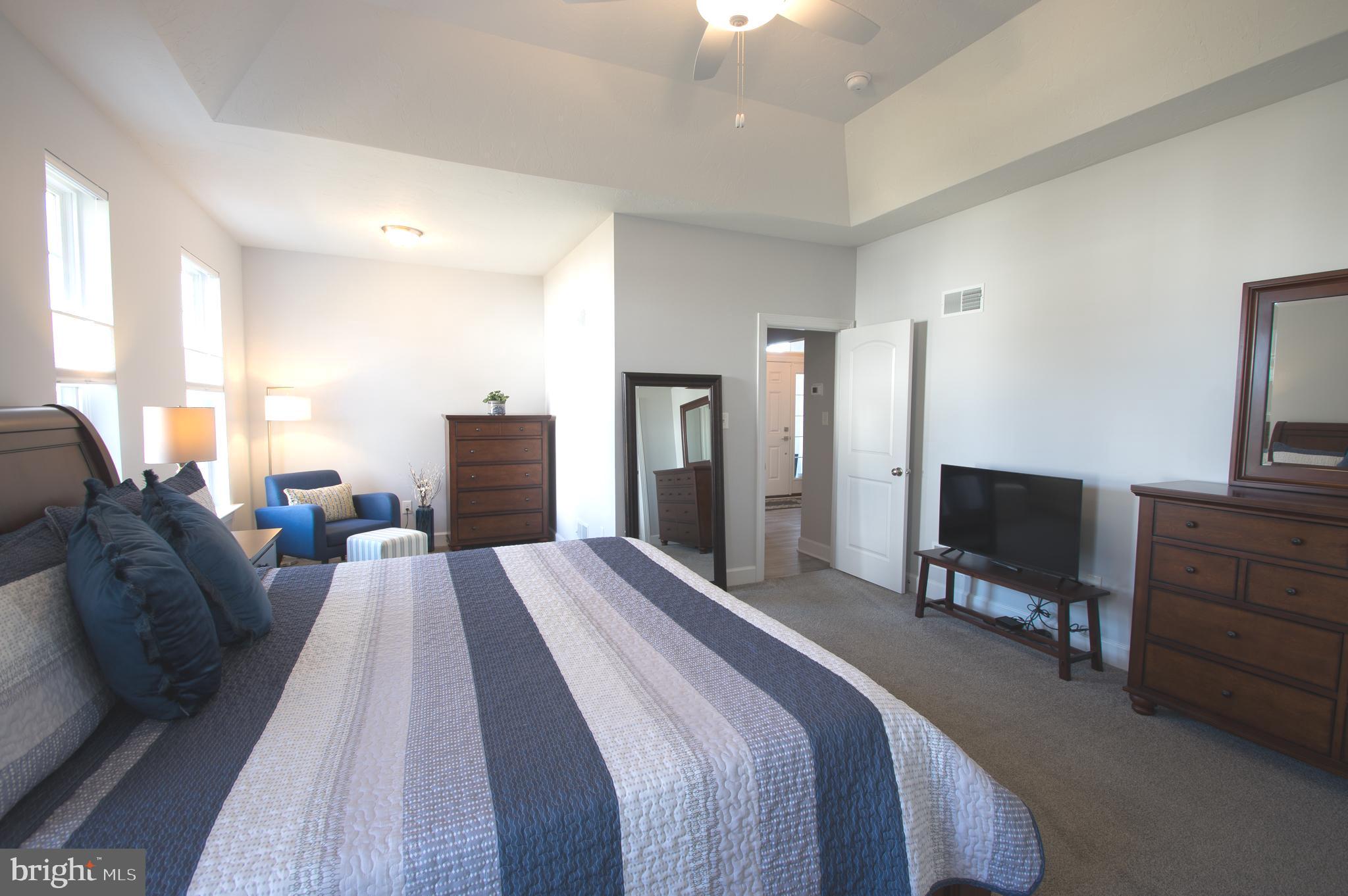 105 Quartz Ridge Road Hanover, PA 17331 - Photo 33 of 51 a spacious bedroom with a bed and a television in it