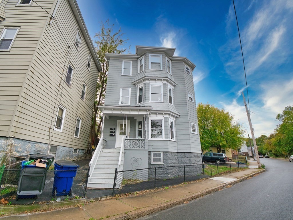 62 Bay Street Fall River, MA 02721 - Photo 1 of 21 a view of a brick house with many windows