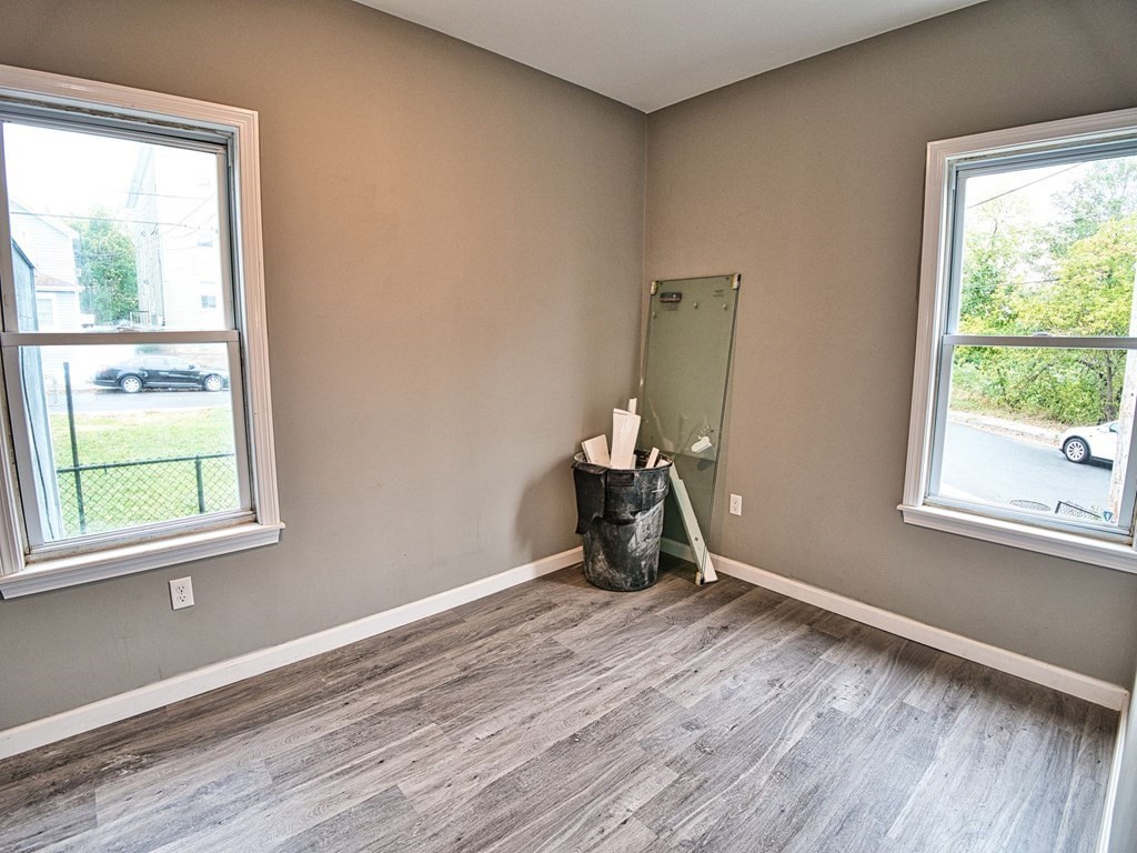 62 Bay Street Fall River, MA 02721 - Photo 14 of 21 a view of a room with a window and wooden floor