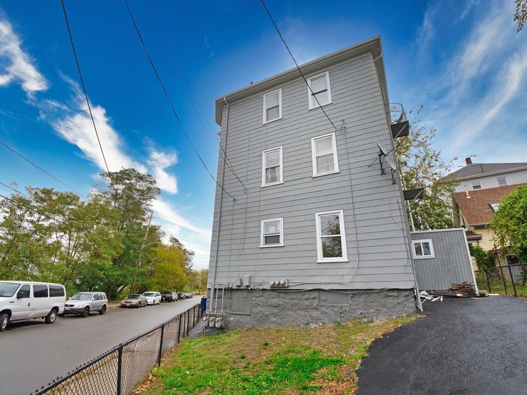 62 Bay Street Fall River, MA 02721 - Photo 21 of 21 a front view of a house with garden
