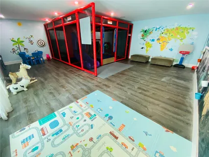 a gym room with lots of gym equipment