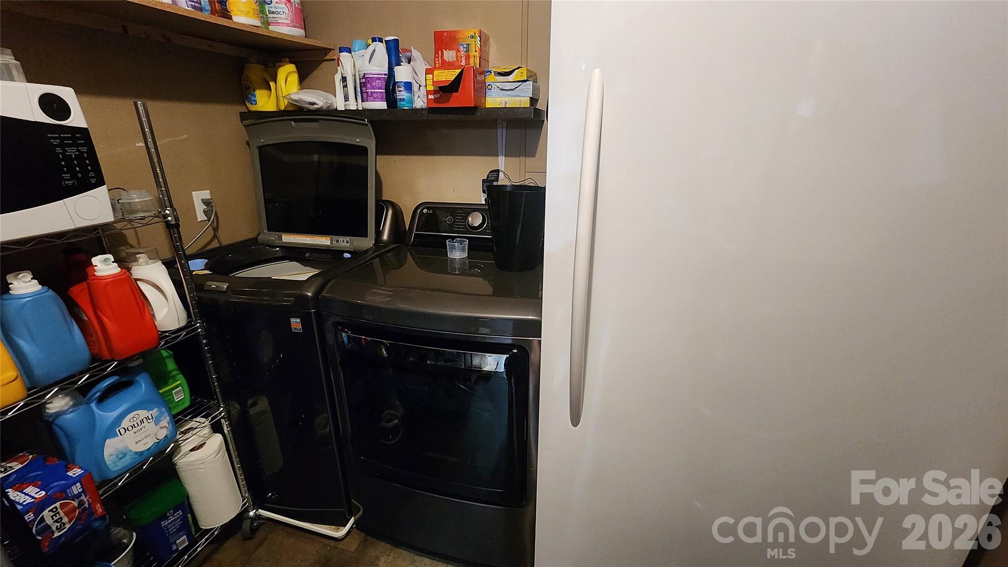 67 Indian Trail Road Candler, NC 28715 - Photo 14 of 31 a utility room with dryer and washer