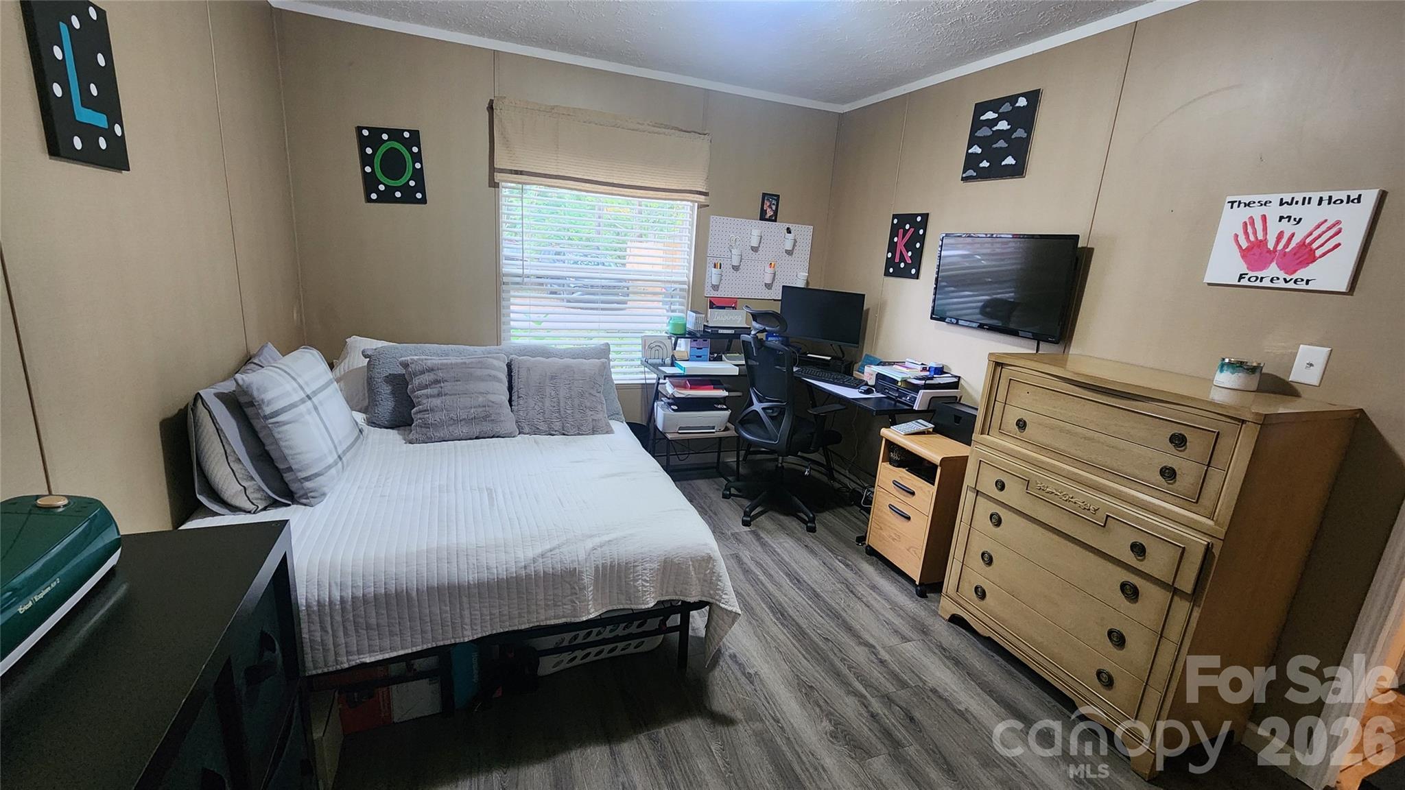 67 Indian Trail Road Candler, NC 28715 - Photo 20 of 31 a bedroom with a bed and furniture