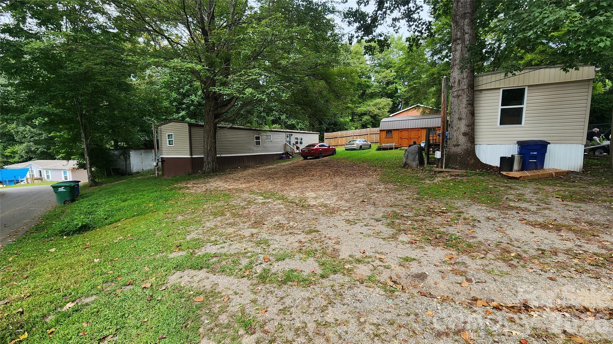 67 Indian Trail Road Candler, NC 28715 - Photo 26 of 31 a house view with a backyard space