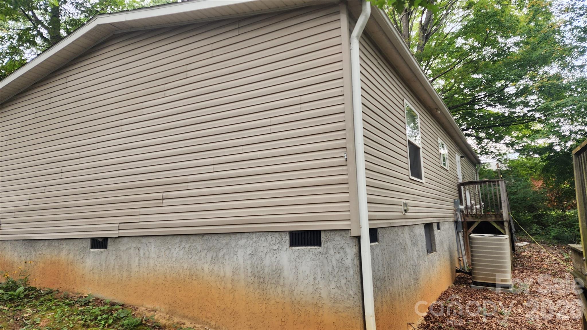 67 Indian Trail Road Candler, NC 28715 - Photo 4 of 31 a view of a house with a balcony