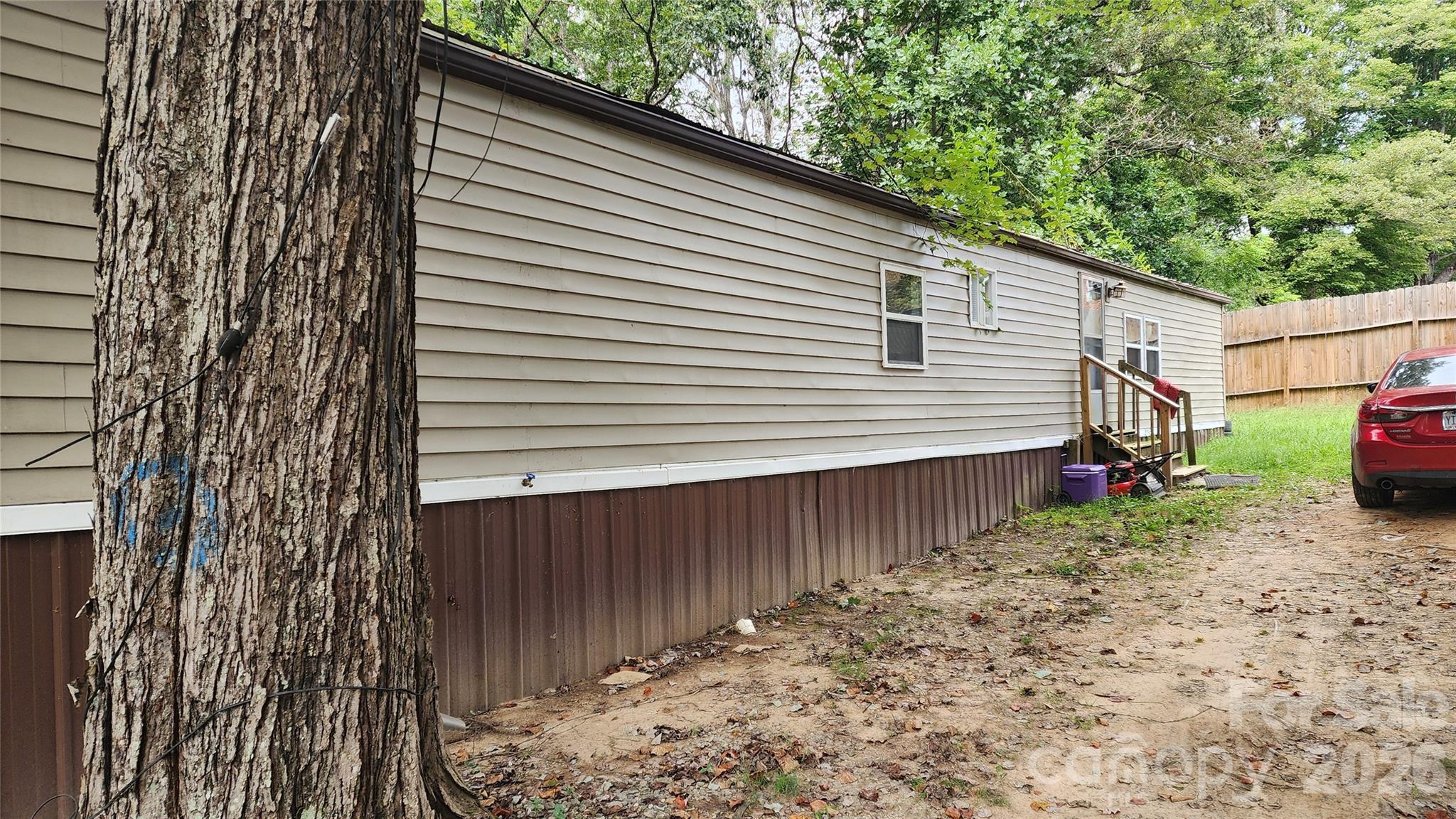 67 Indian Trail Road Candler, NC 28715 - Photo 7 of 31 a view of a house with a yard