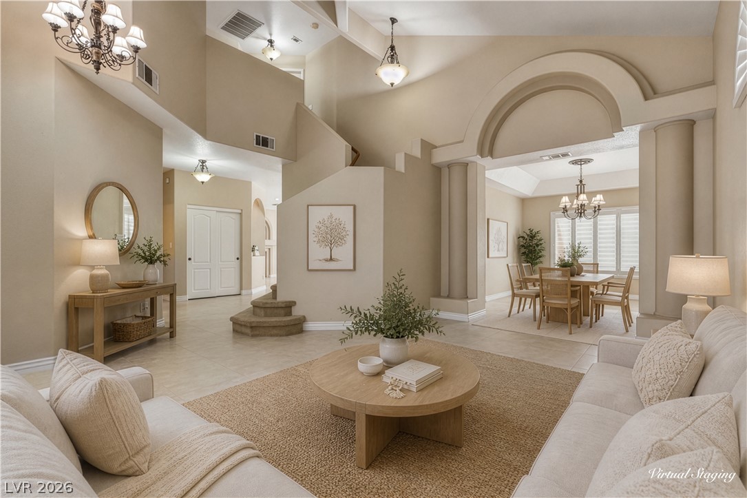 29 Olive Tree Henderson, NV 89074 - Photo 6 of 60 This expansive living space features elegant archways and an inviting dining area, perfect for entertaining.