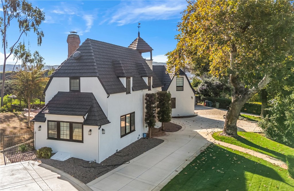 745 West Sunset Drive Redlands, CA 92373 - Photo 20 of 34 a front view of a house with a yard