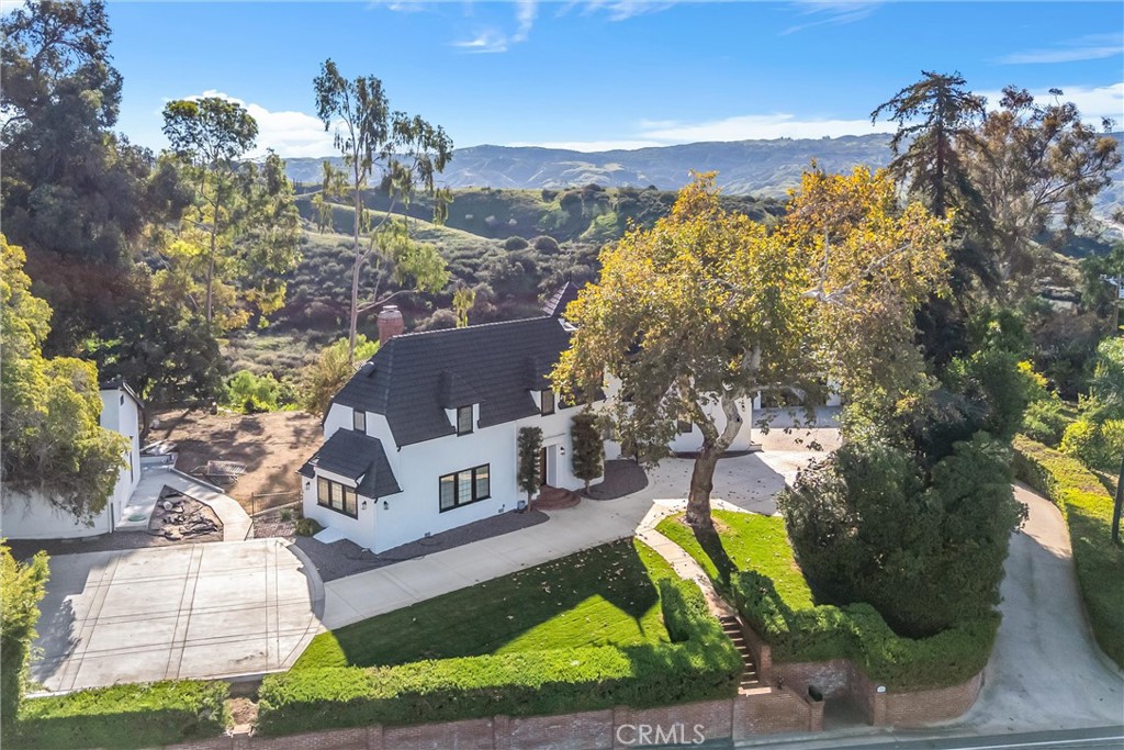 745 West Sunset Drive Redlands, CA 92373 - Photo 33 of 34 a view of a house with a yard and a large tree