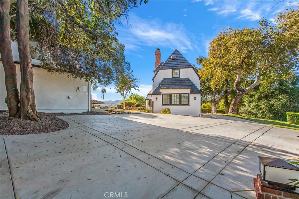 745 West Sunset Drive Redlands, CA 92373 - Photo 5 of 34 a front view of a house with a yard