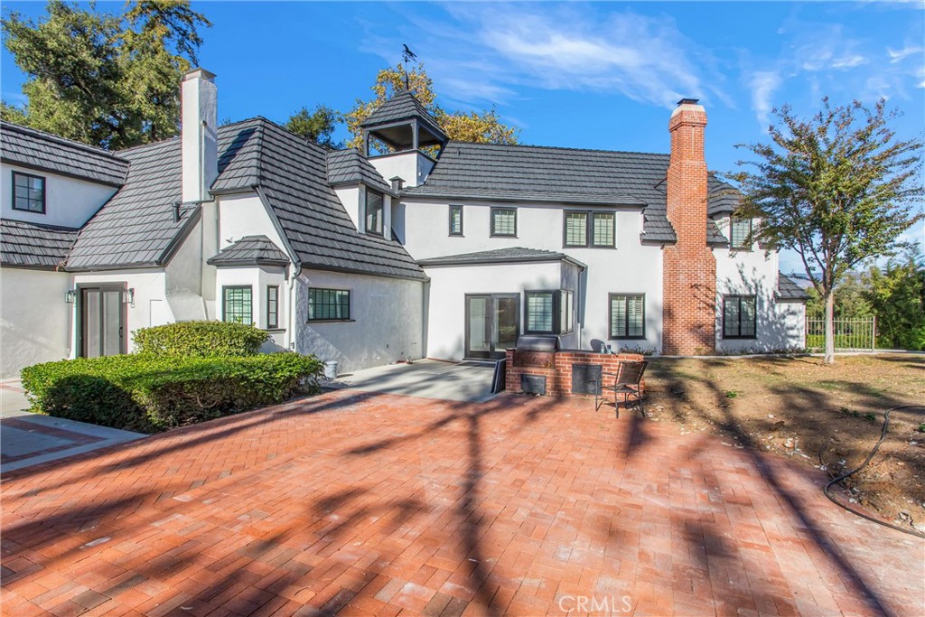 745 West Sunset Drive Redlands, CA 92373 - Photo 10 of 34 a front view of a house with yard and green space