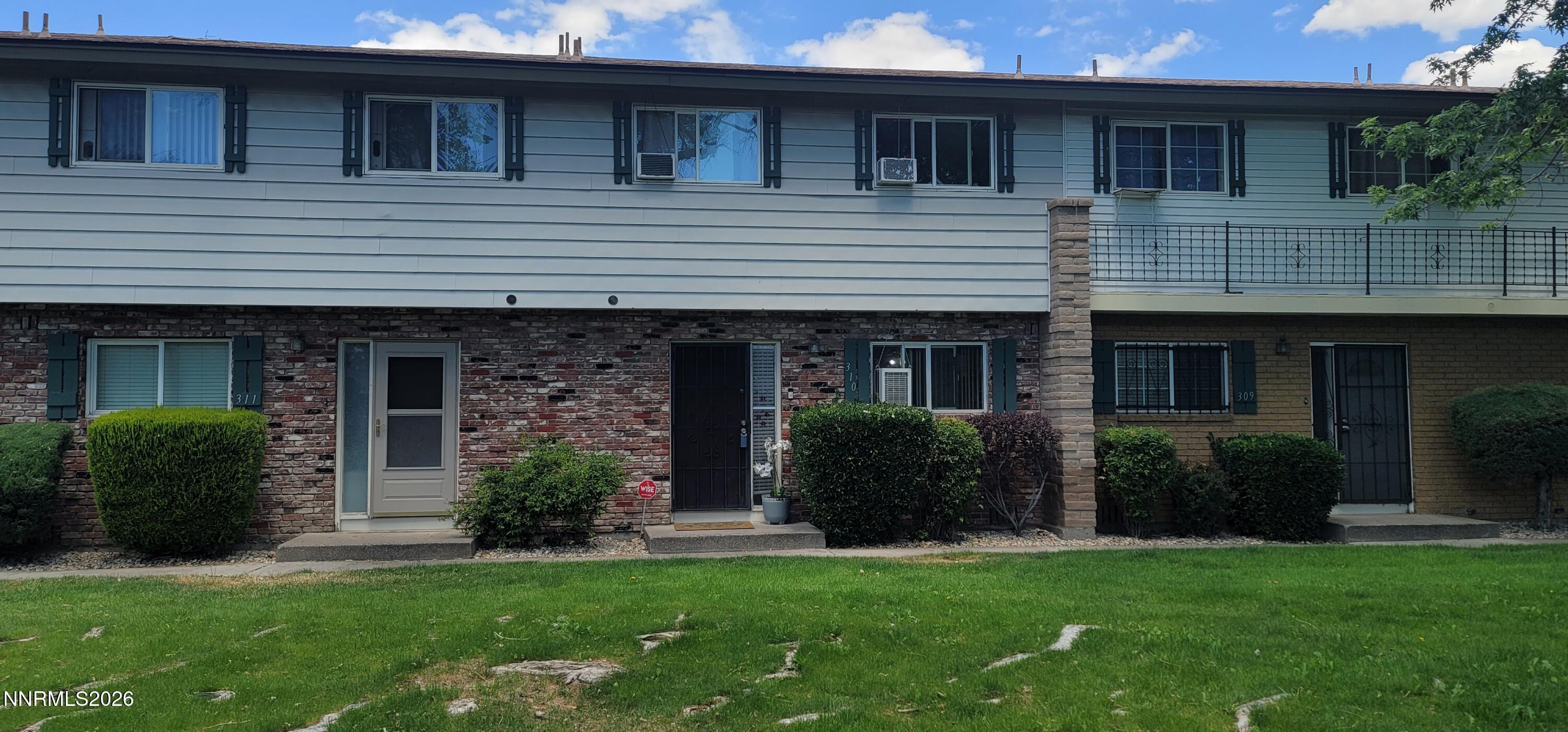 310 Smithridge Park Reno, NV 89502 - Photo 2 of 2 a view of a house with a garden and plants