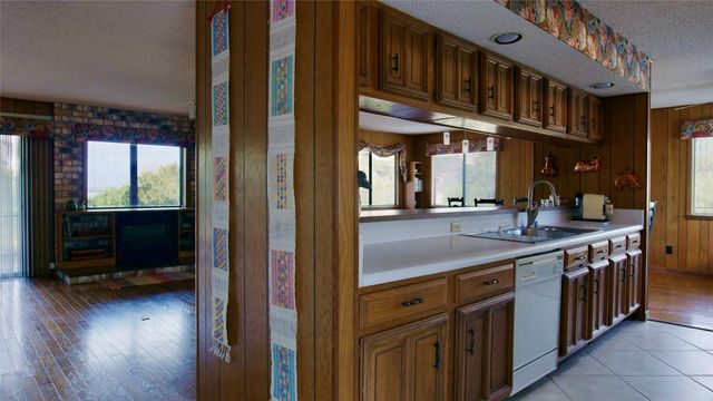 a view of a dining room with furniture and window