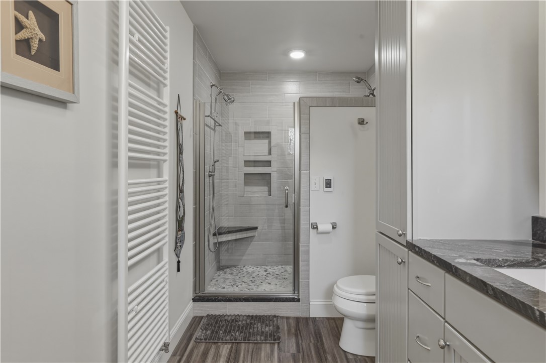 5580 Peach Orchard Road Hector, NY 14841 - Photo 24 of 50 Primary suite bathroom with radiant heat shower ti