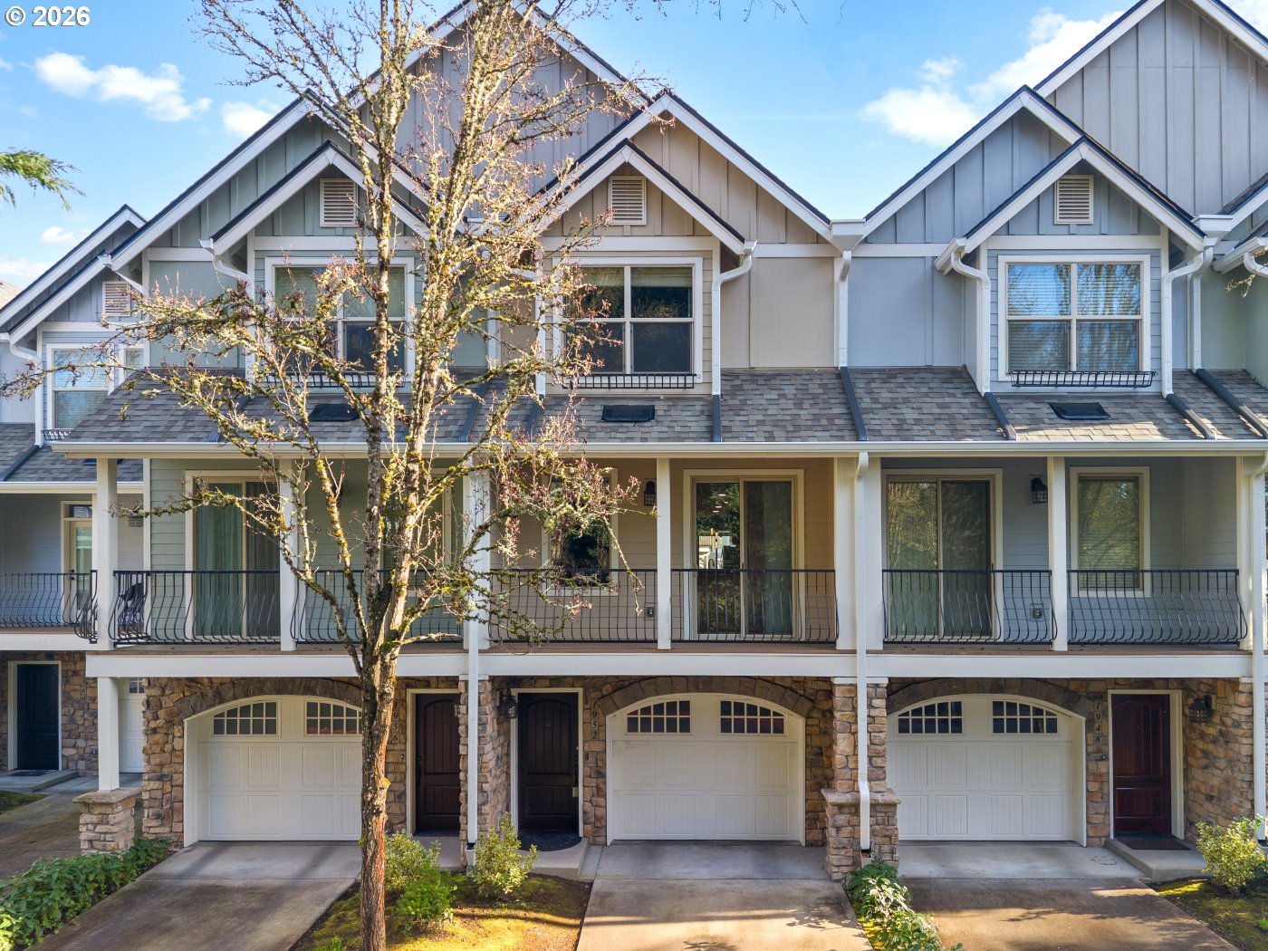 1952 Northeast 48th Way Hillsboro, OR 97124 - Photo 1 of 43 a front view of a house with a yard and garage