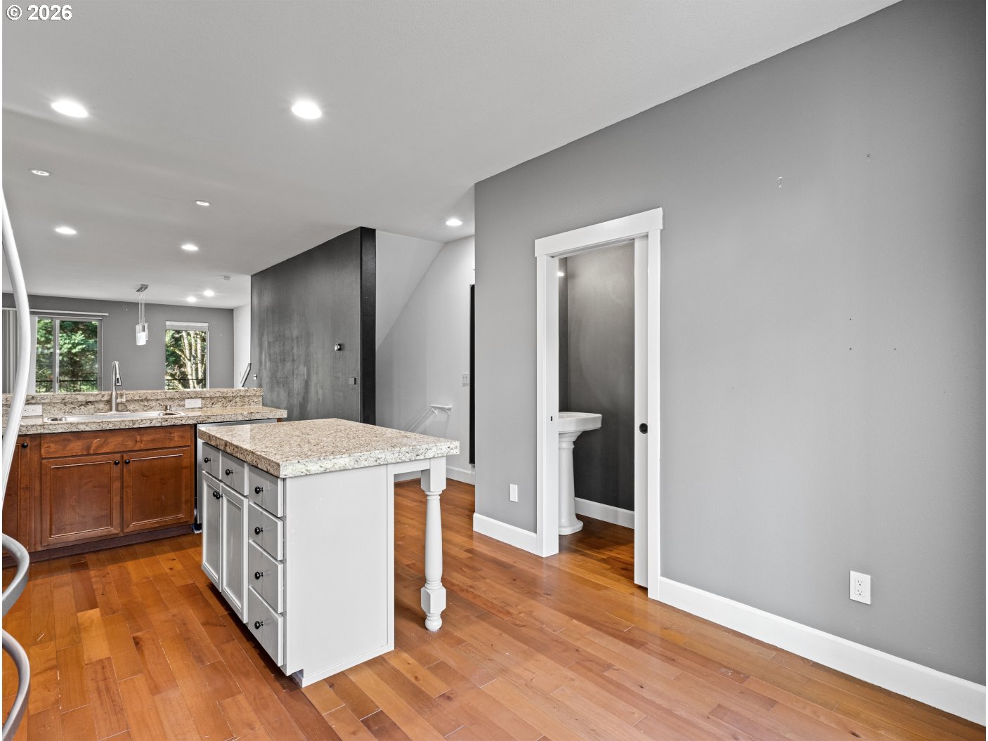 1952 Northeast 48th Way Hillsboro, OR 97124 - Photo 12 of 43 a kitchen with a stove and wooden floor
