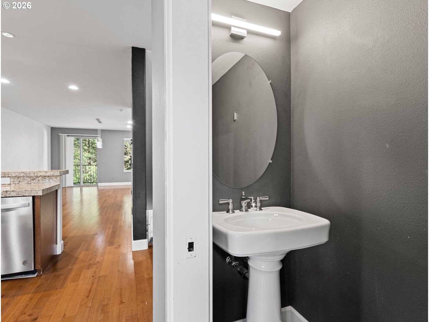 1952 Northeast 48th Way Hillsboro, OR 97124 - Photo 13 of 43 a bathroom with a sink a mirror and a shower