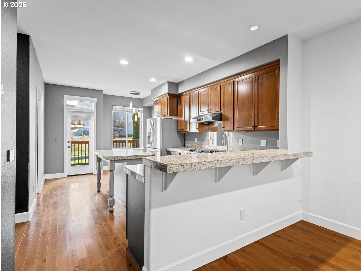 1952 Northeast 48th Way Hillsboro, OR 97124 - Photo 14 of 43 a kitchen with counter top space and wooden floor
