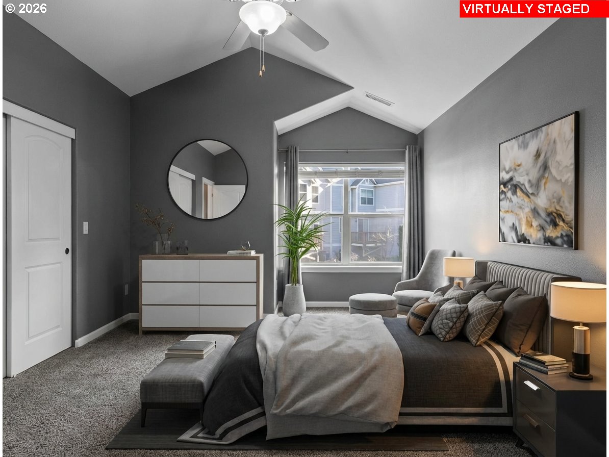 1952 Northeast 48th Way Hillsboro, OR 97124 - Photo 21 of 43 a bedroom with a bed and a chandelier