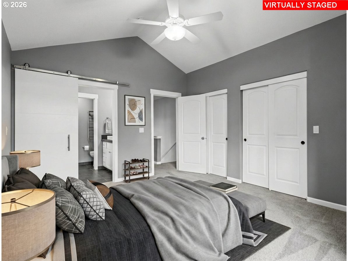 1952 Northeast 48th Way Hillsboro, OR 97124 - Photo 22 of 43 a bedroom with a bed and a chandelier