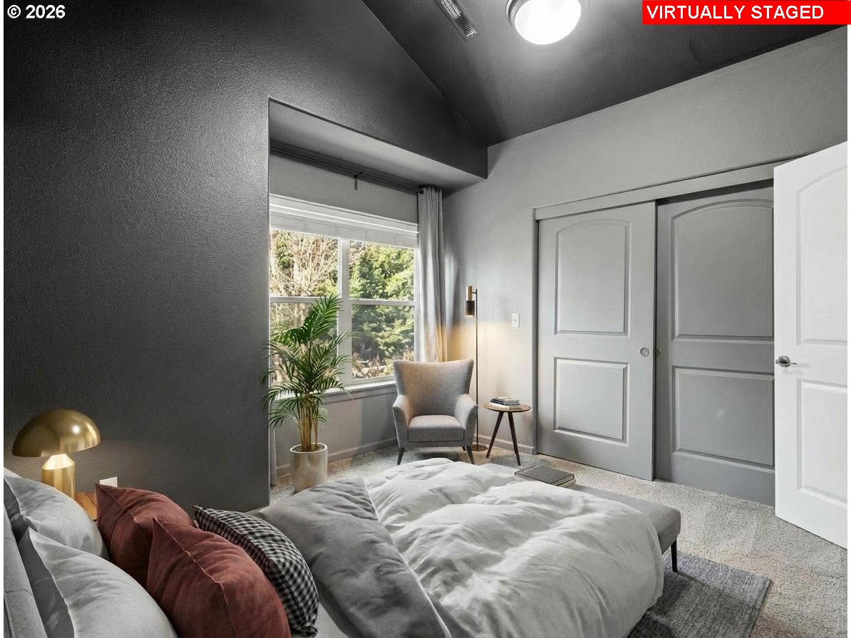 1952 Northeast 48th Way Hillsboro, OR 97124 - Photo 30 of 43 a bedroom with a bed and chair