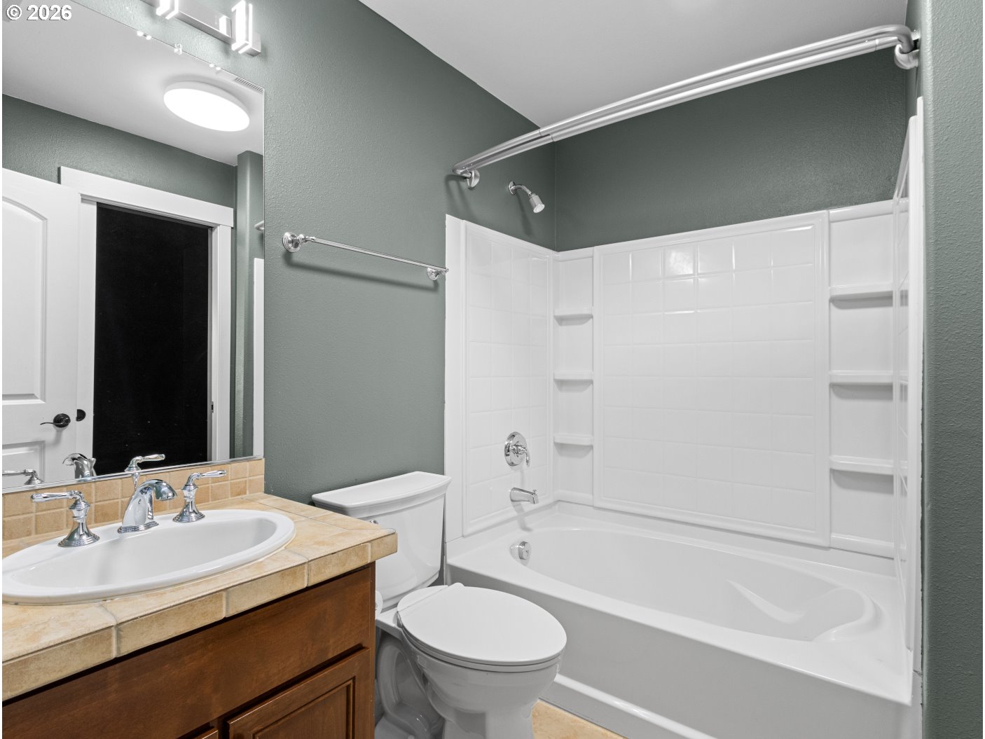 1952 Northeast 48th Way Hillsboro, OR 97124 - Photo 32 of 43 a bathroom with a bathtub shower sink vanity and toilet