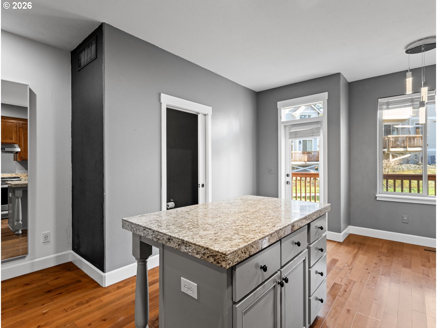 1952 Northeast 48th Way Hillsboro, OR 97124 - Photo 7 of 43 an empty room with kitchen and window