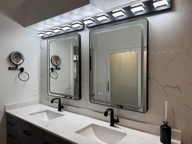 a large bed sitting in a bedroom next to a window