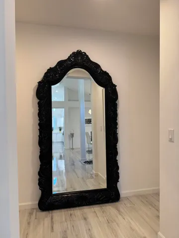 a living room with furniture and a garden