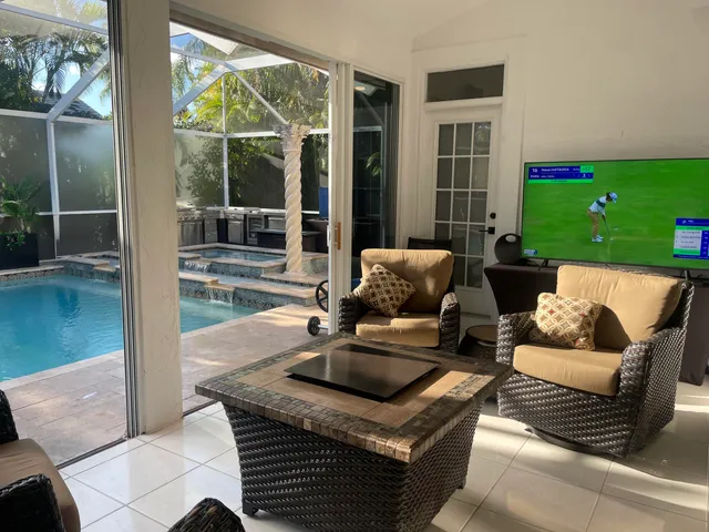 view of living room with furniture and floor to ceiling window