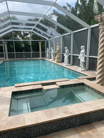 an aerial view of a city with lots of residential buildings lake and ocean view