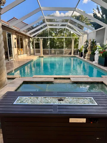 a view of a house with palm trees