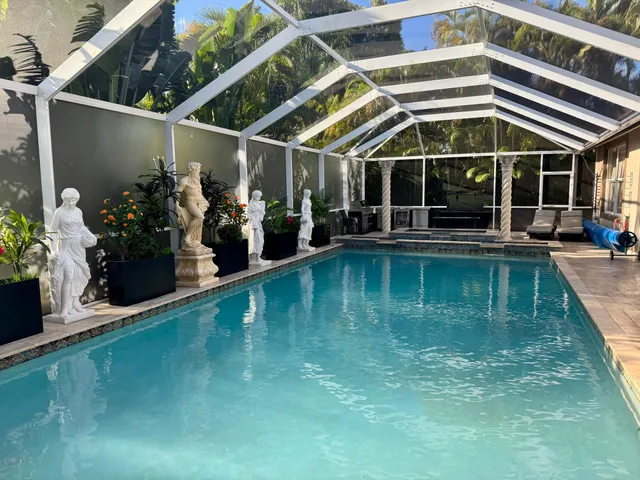 a living room with stainless steel appliances granite countertop furniture rug and view of kitchen