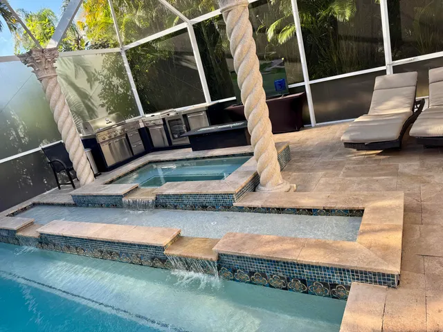 a view of backyard with swimming pool and outdoor seating