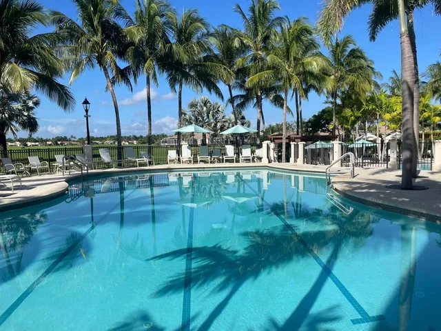 a view of a patio with chairs and tables
