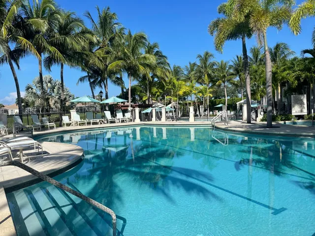an aerial view of a city with lawn chairs