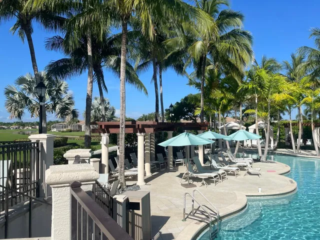 a front view of a house with a garden and yard