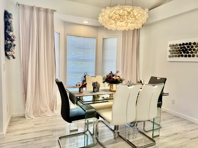 a kitchen with a refrigerator and cabinets