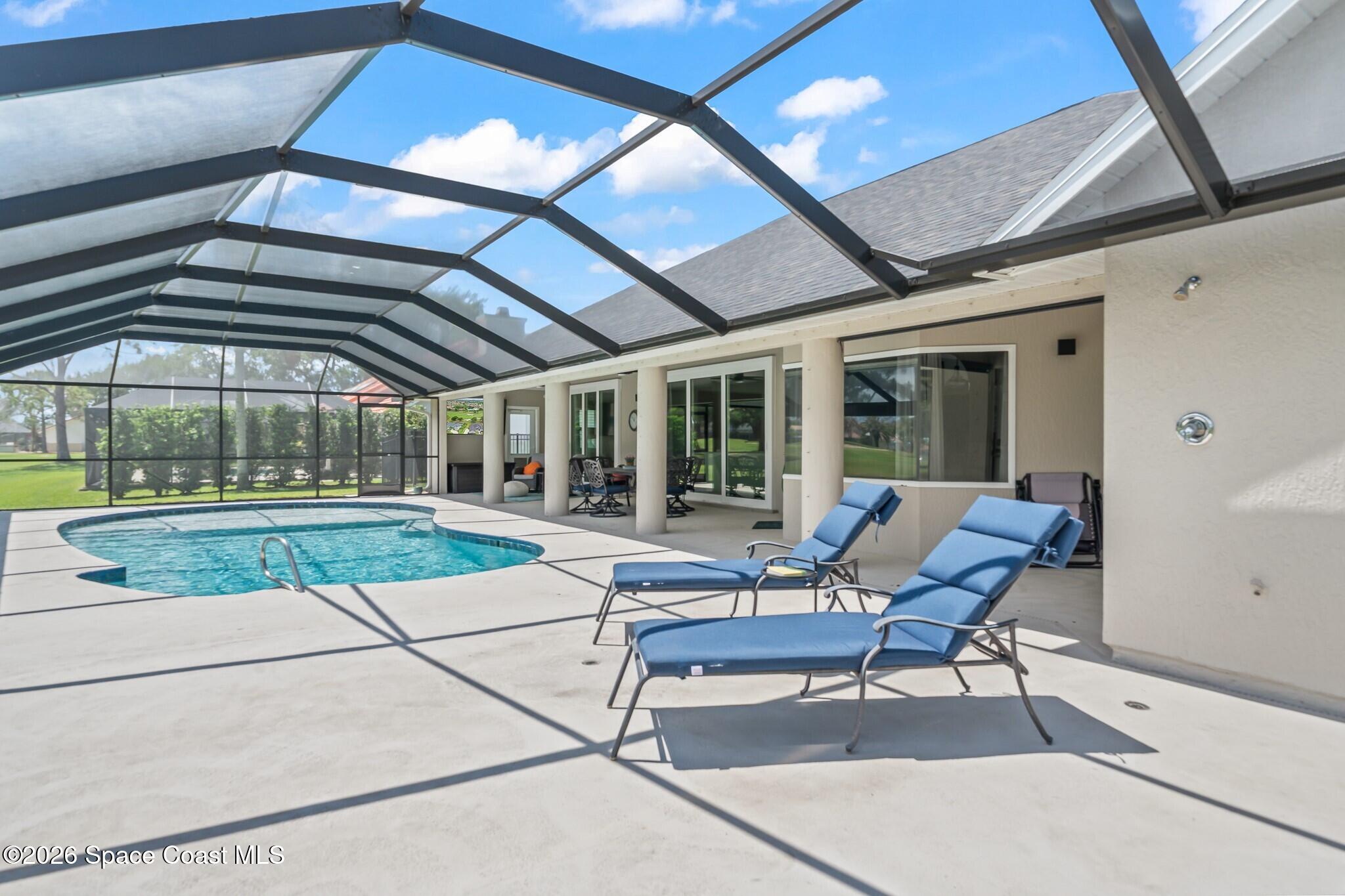 697 Spring Lake Drive Melbourne, FL 32940 - Photo 32 of 45 a building outdoor space with patio furniture and potted plants