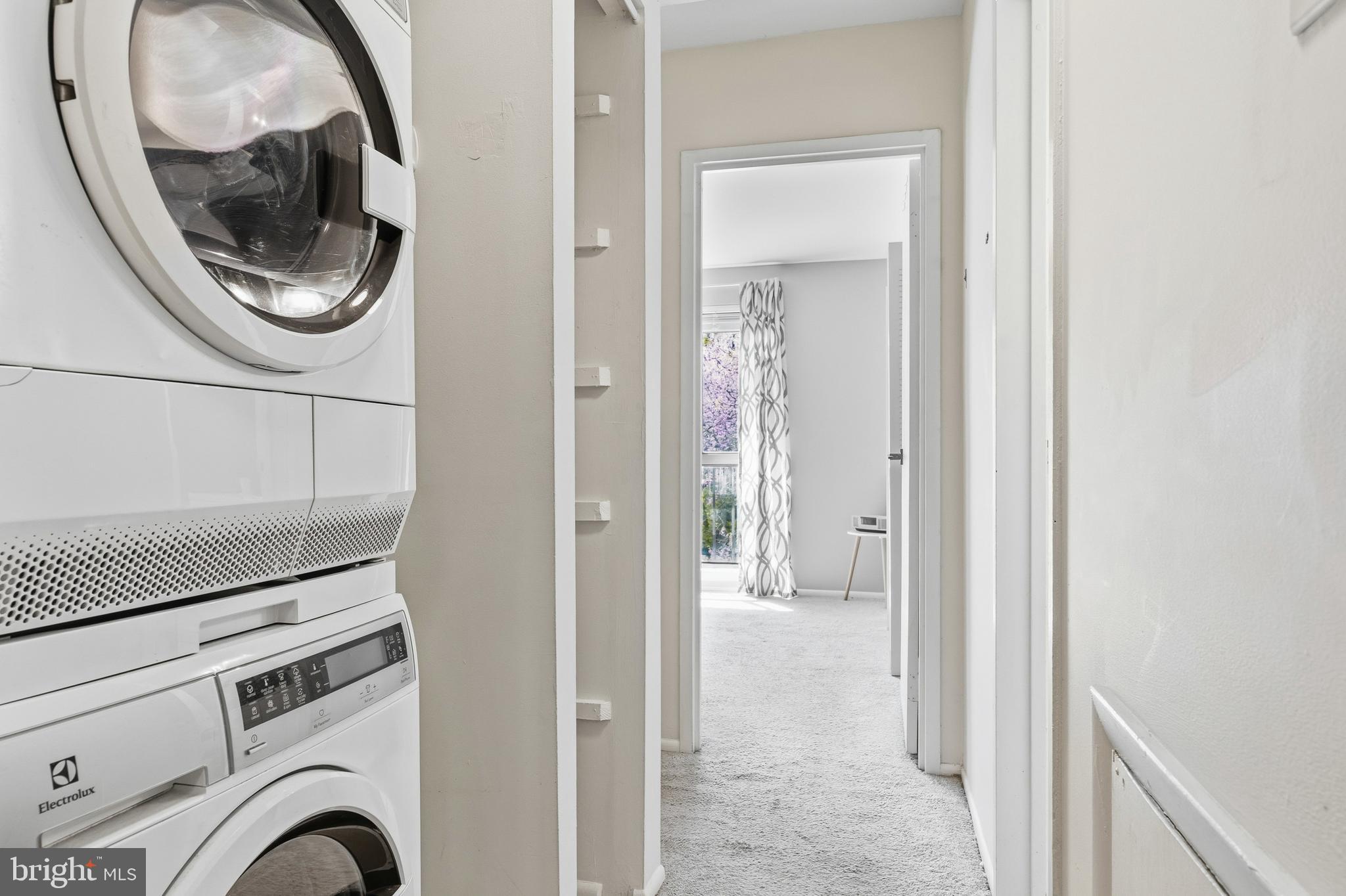 2032 Royal Fern Court, Unit 13/21A Reston, VA 20191 - Photo 17 of 28 a view of a hallway with washer and dryer