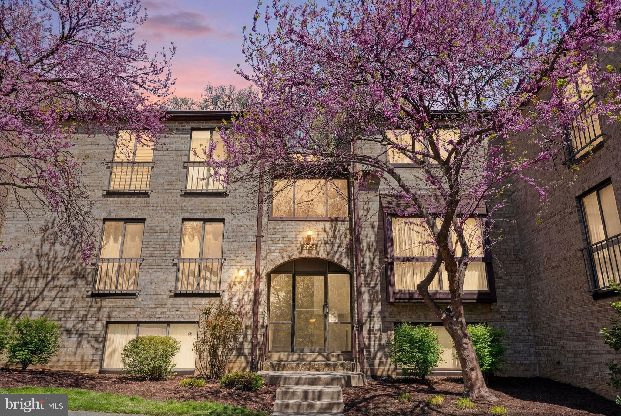 2032 Royal Fern Court, Unit 13/21A Reston, VA 20191 - Photo 2 of 28 a front view of a house with garden