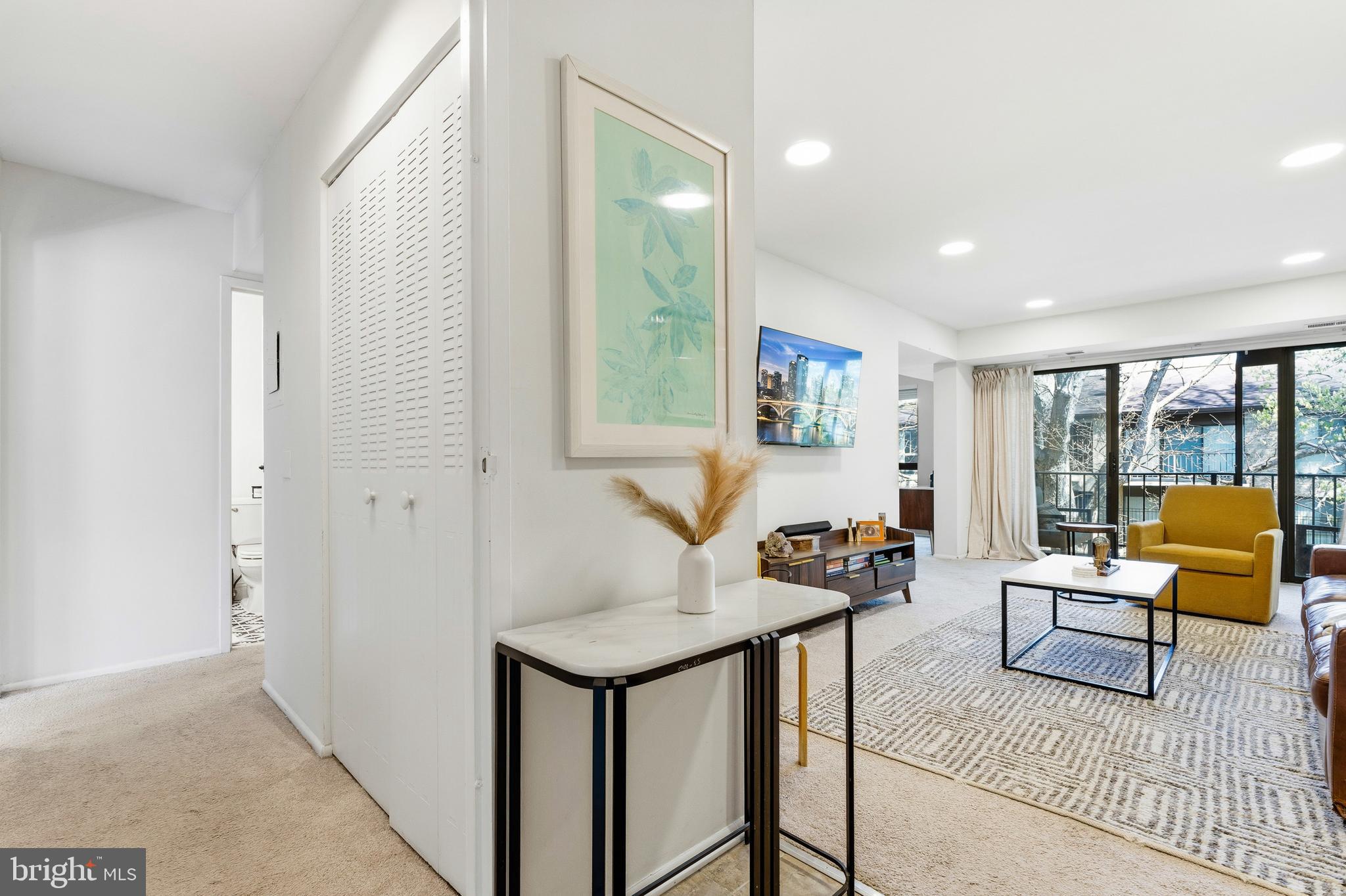 2032 Royal Fern Court, Unit 13/21A Reston, VA 20191 - Photo 4 of 28 a living room with furniture and a large window