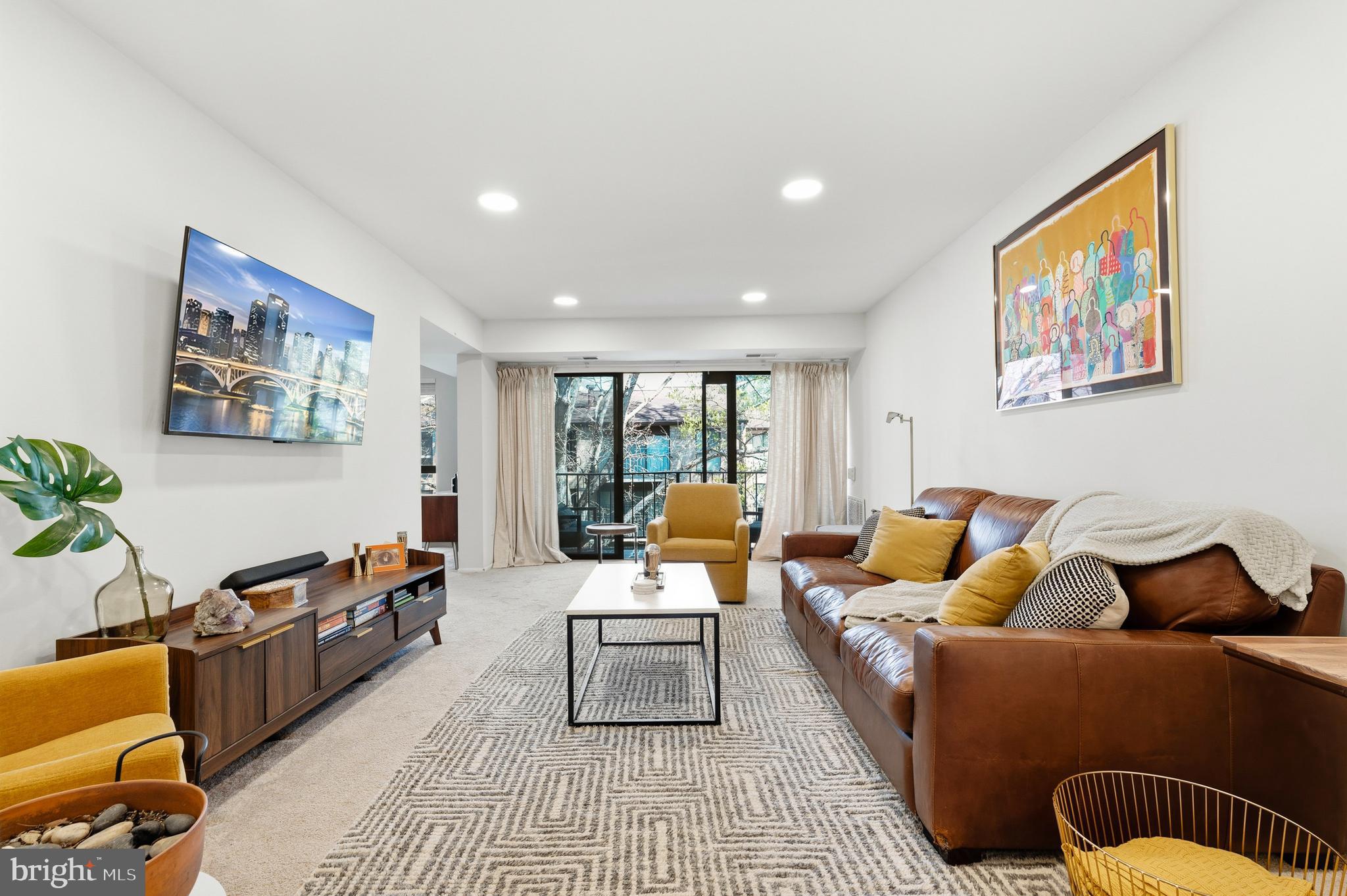 2032 Royal Fern Court, Unit 13/21A Reston, VA 20191 - Photo 5 of 28 a living room with furniture and a couch