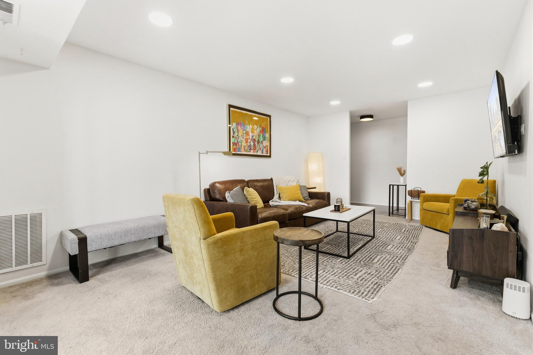 2032 Royal Fern Court, Unit 13/21A Reston, VA 20191 - Photo 7 of 28 a living room with furniture and a flat screen tv