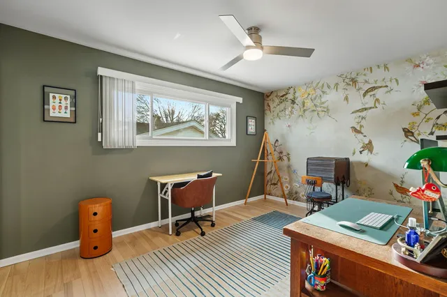 a view of a workspace with furniture and toys