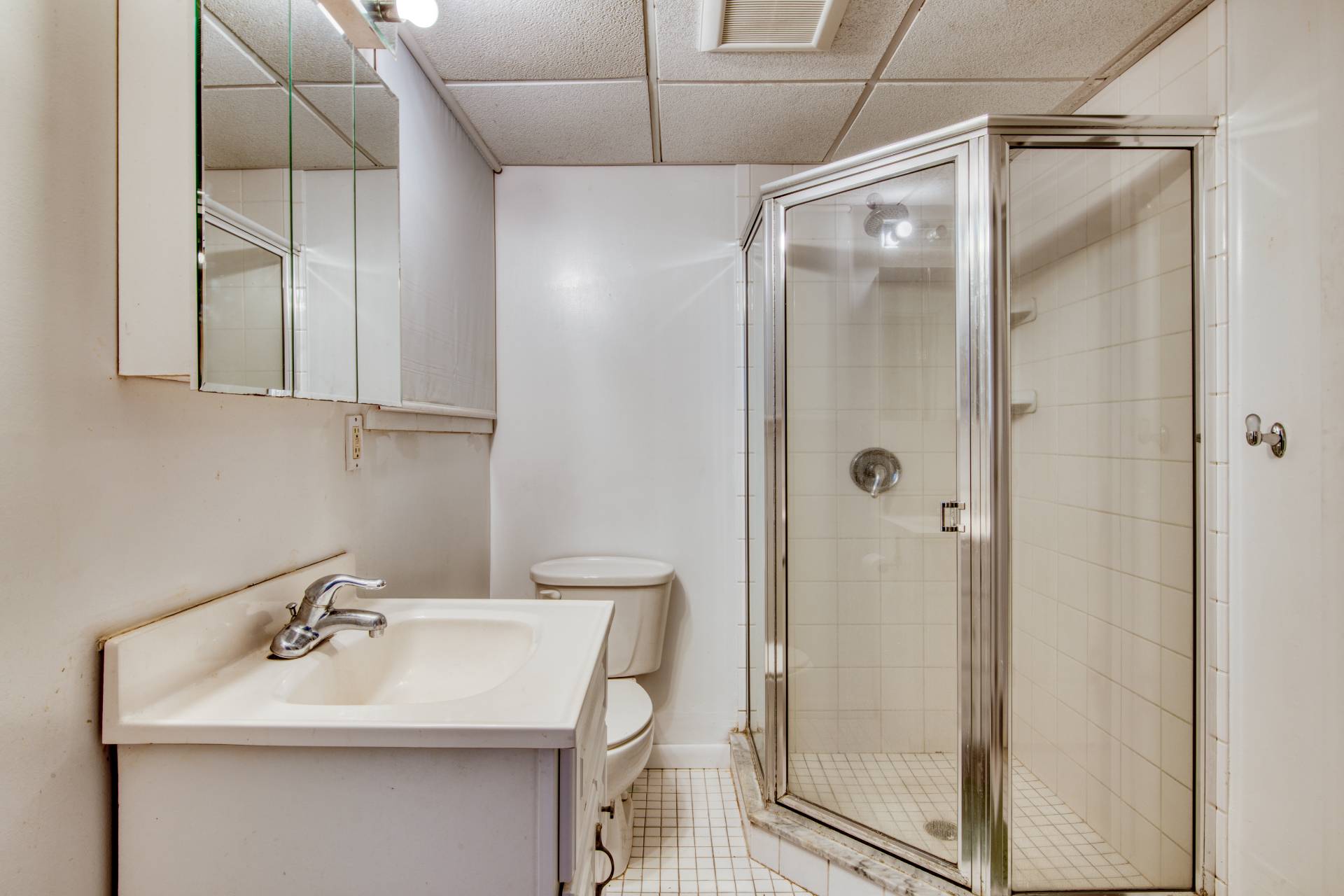 36 Barnes Avenue East Hampton, NY 11937 - Photo 11 of 13 a bathroom with a sink and mirror