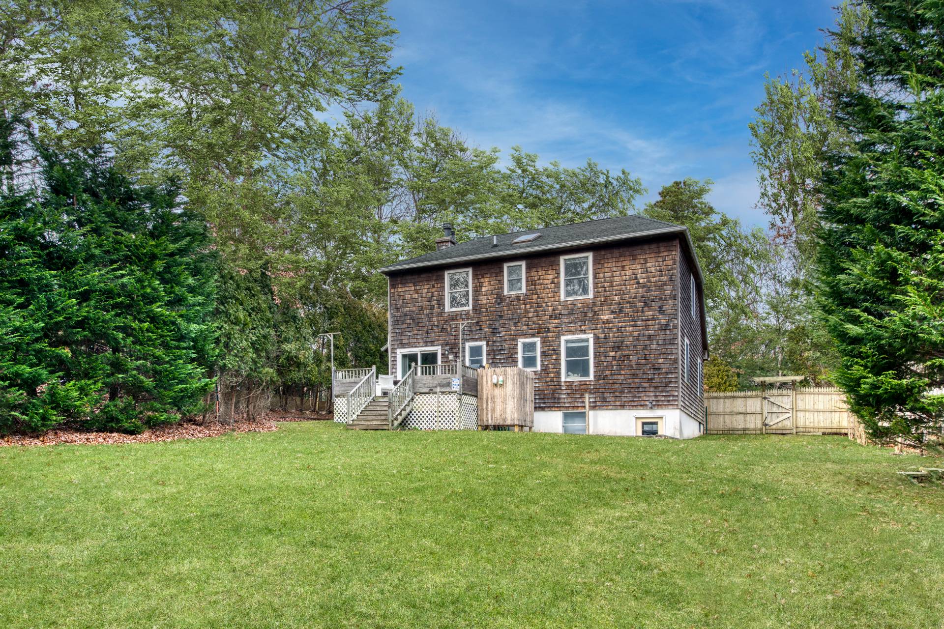 36 Barnes Avenue East Hampton, NY 11937 - Photo 12 of 13 a front view of a house with garden