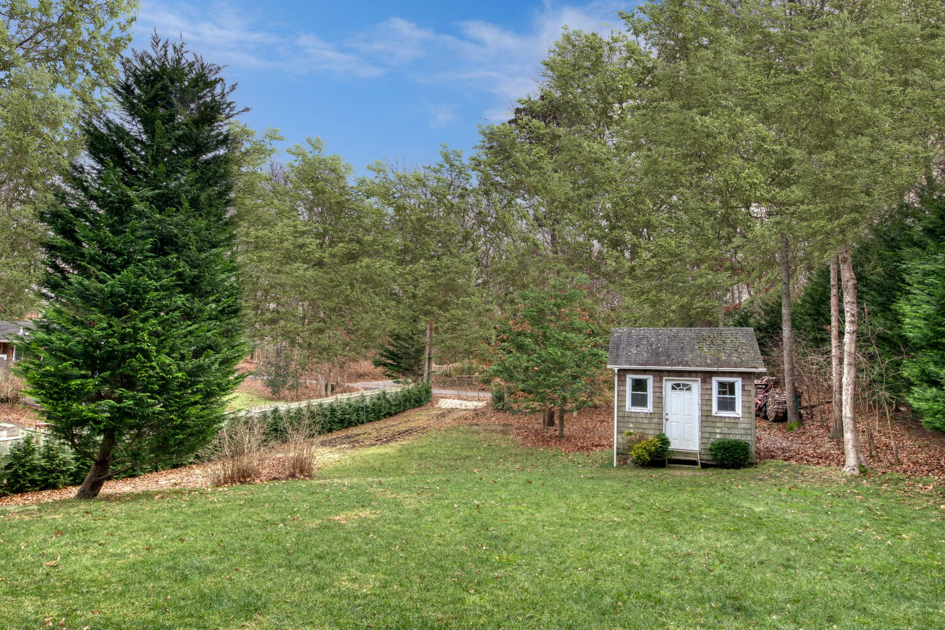 36 Barnes Avenue East Hampton, NY 11937 - Photo 13 of 13 a view of a house with a yard