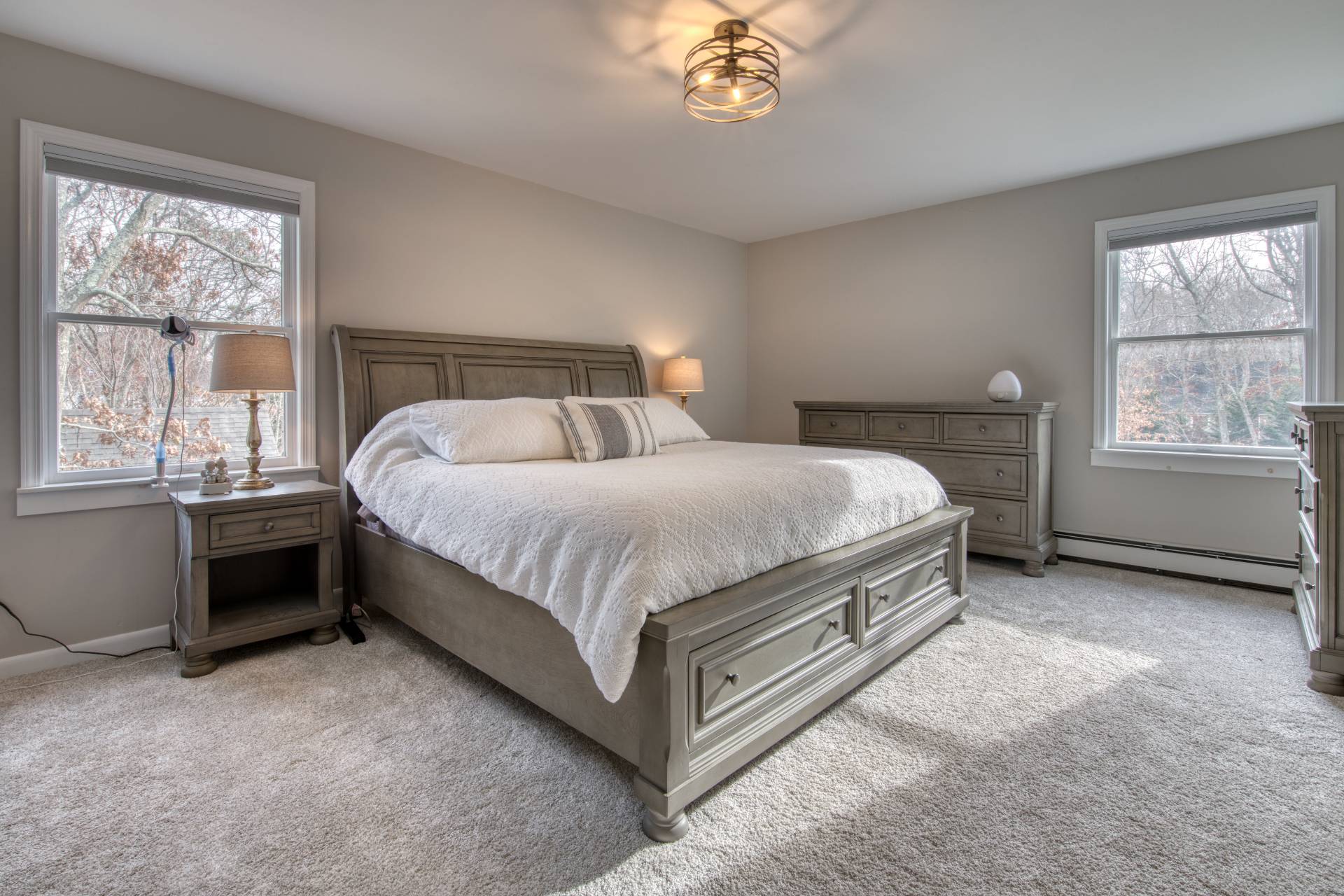 36 Barnes Avenue East Hampton, NY 11937 - Photo 5 of 13 a bedroom with a bed and a window