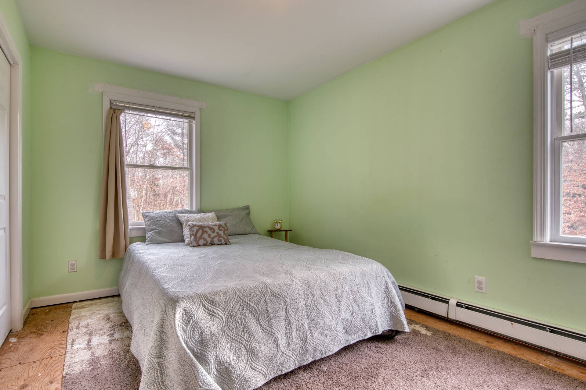 36 Barnes Avenue East Hampton, NY 11937 - Photo 10 of 13 a bedroom with a bed and windows